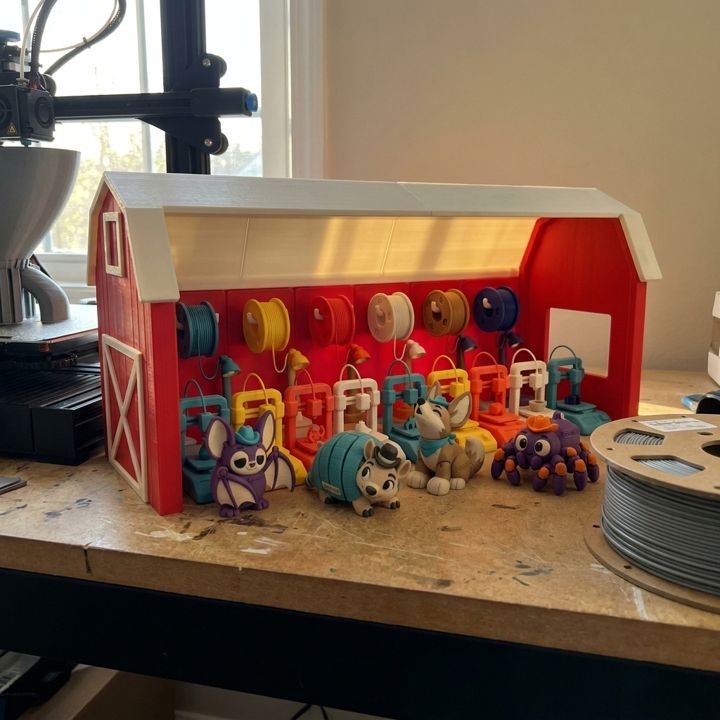 The Printer Ranch playset on the workbench, next to a printer and a spool of filament